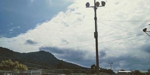 Low angle view of street light against sky