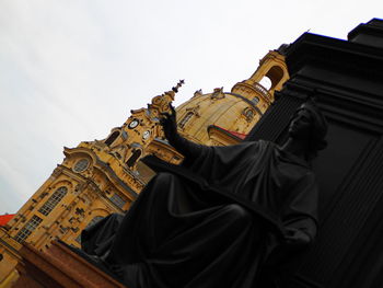 Low angle view of statue against building