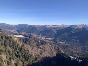 Scenic view of mountains against clear blue sky