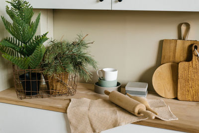 Kitchen utensils in the scandinavian kitchen. christmas tree in a pot,