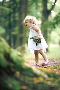 Full length of woman with arms raised