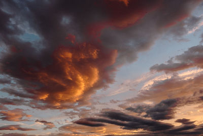 Low angle view of dramatic sky during sunset