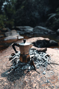 Close-up of coffee cup on wood