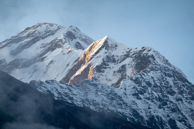 Scenic view of snowcapped mountain against sky