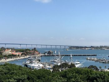 High angle view of marina in city against clear sky