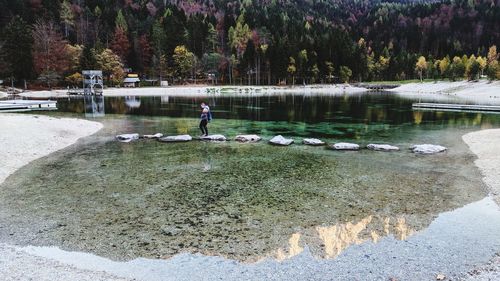 Man standing by lake