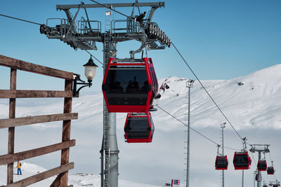 Gondola type ropeway on the slope of ski resort above clouds. erciyes ski resort. kayseri, turkey