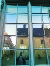 Reflection of building on glass window