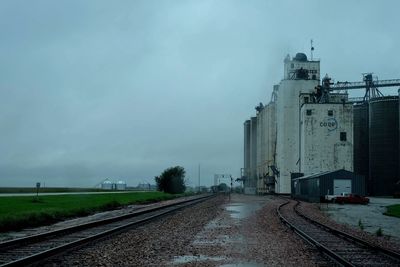 Train on railroad track against sky