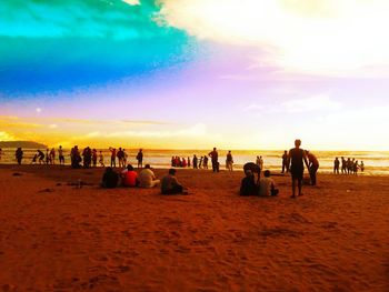 People relaxing on beach