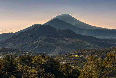 Scenic view of mountains against sky during sunset