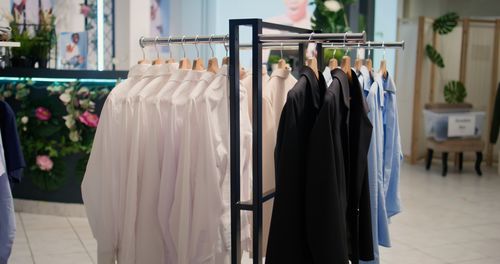 Close-up of clothes hanging on rack