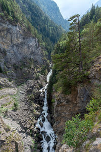 Scenic view of stream flowing through rocks