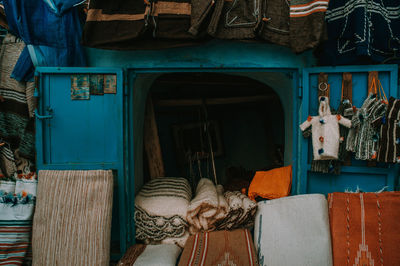 Rear view of man outside building/ view of a market 