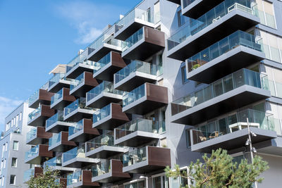 Low angle view of modern buildings against sky