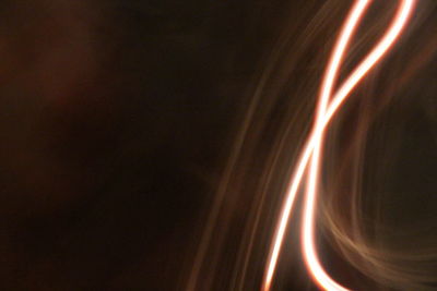 Close-up of light trails against black background