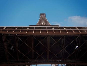 Low angle view of tower against cloudy sky