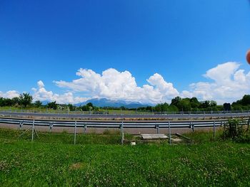 Scenic view of field against blue sky