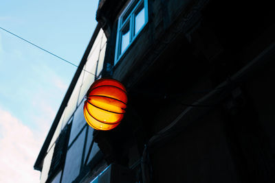 Orange light hanging on wire