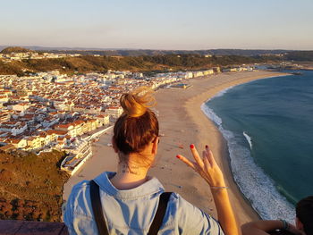 High angle view of woman looking at sea