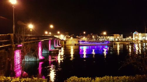 View of illuminated street lights at night