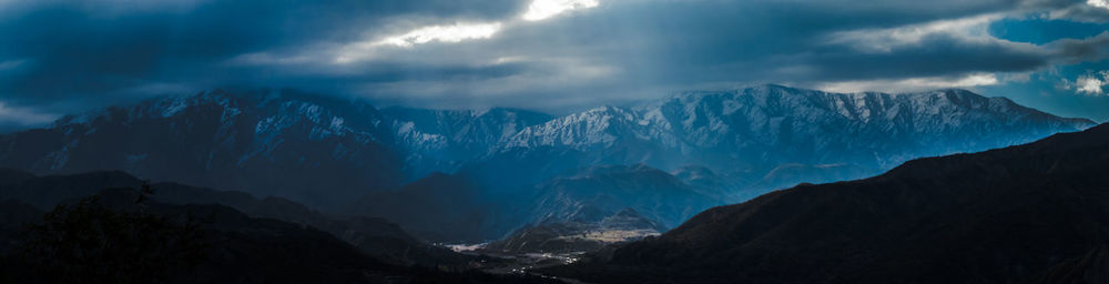 Scenic view of snowcapped mountains against sky