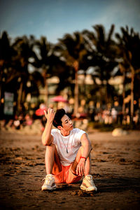 Full length of a girl sitting on land