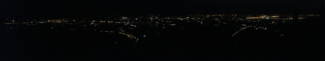 Aerial view of illuminated city at night