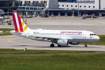 View of airplane at airport runway