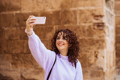 Young woman using mobile phone