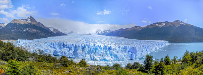 Panoramic view of snowcapped mountains against sky