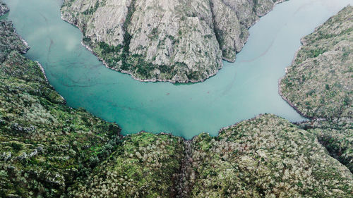 High angle view of lake amidst rocks