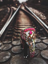 High angle view of woman standing by railroad tracks