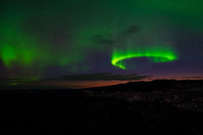 Scenic view of mountain against sky at night