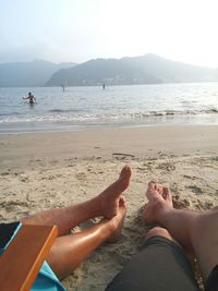 Tourists relaxing on beach