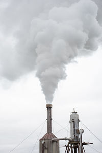 Geothermal power station steams in iceland. clean green energy concept