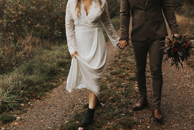 Rear view of couple walking outdoors