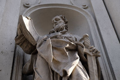 Low angle view of angel statue against temple