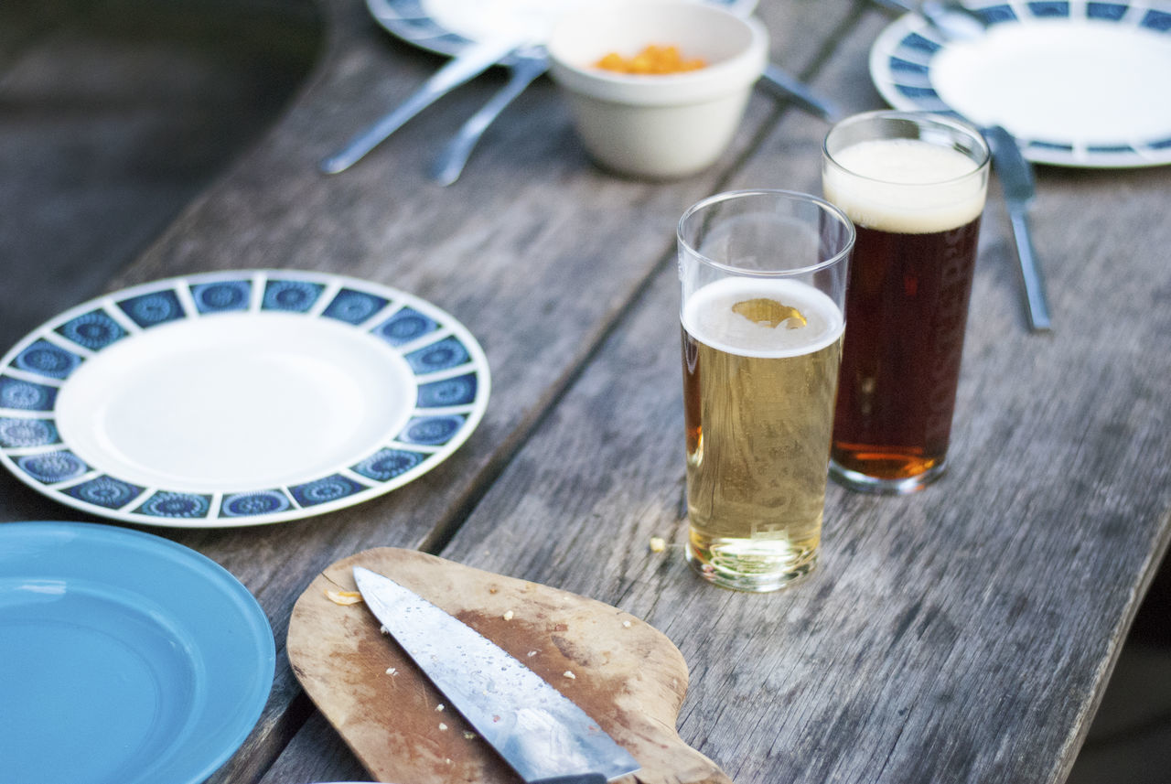 table, food and drink, drink, refreshment, beer, still life, food, drinking glass, high angle view, beer - alcohol, glass, household equipment, plate, wood - material, freshness, no people, alcohol, beer glass, indoors, cup