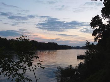 Scenic view of lake against cloudy sky