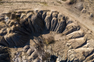 Industrial mining landscape from a drone. aerial view of abandoned open pit mine, nature pollution