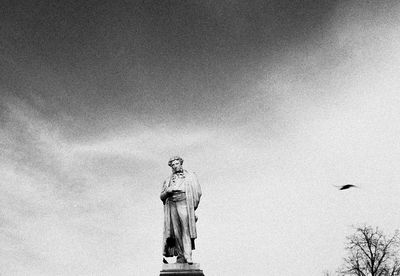 Low angle view of statue against sky