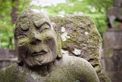 Close-up of angel statue in cemetery