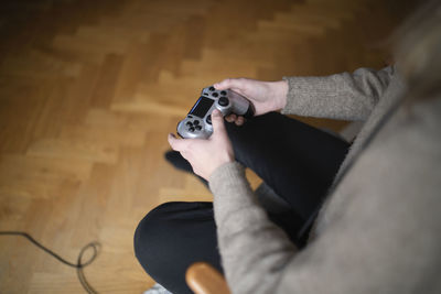 Woman's hands holding game control