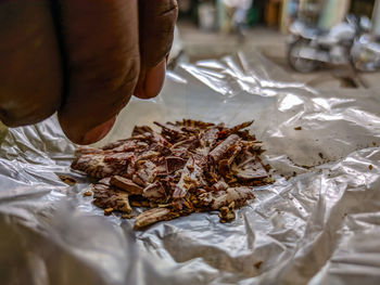 Midsection of person working at food