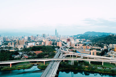 High angle view of bridge and buildings against sky