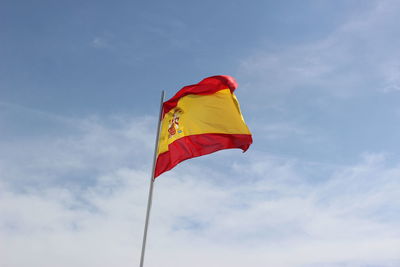 Low angle view of flag against sky