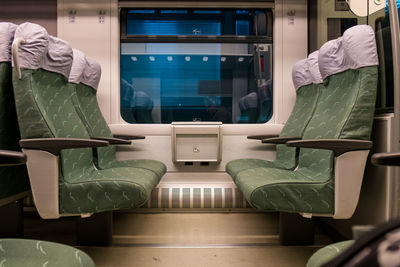 Empty green seats in train