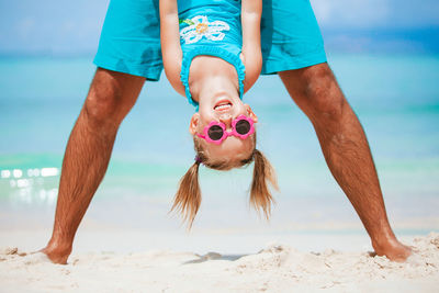 Low angle view of child on beach