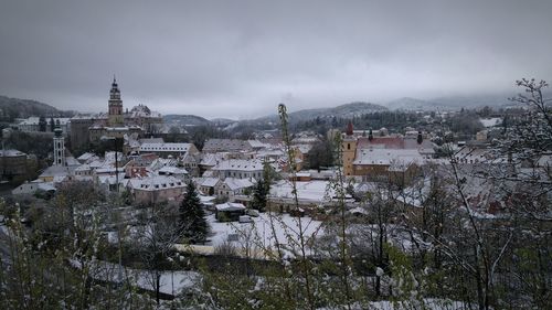 Town against sky during winter